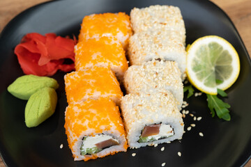 delicious traditional Japanese sushi and rolls on a plate
