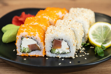 delicious traditional Japanese sushi and rolls on a plate