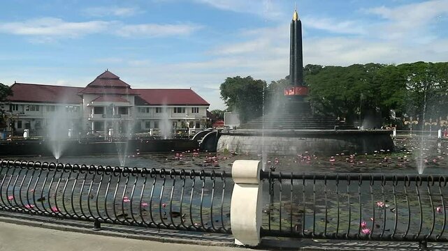 Alun-Alun Tugu is a round square located in front of the City Hall of Malang City, East Java. The square was built in 1920 by the Dutchman Thomas Karsten, surrounded by fountains and lotus ponds. 