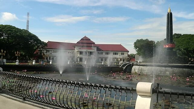Alun-Alun Tugu is a round square located in front of the City Hall of Malang City, East Java. The square was built in 1920 by the Dutchman Thomas Karsten, surrounded by fountains and lotus ponds. 