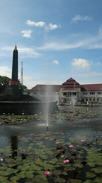 Alun-Alun Tugu is a round square located in front of the City Hall of Malang City, East Java. The square was built in 1920 by the Dutchman Thomas Karsten, surrounded by fountains and lotus ponds. 