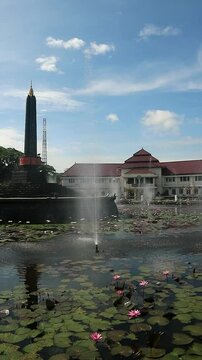 Alun-Alun Tugu is a round square located in front of the City Hall of Malang City, East Java. The square was built in 1920 by the Dutchman Thomas Karsten, surrounded by fountains and lotus ponds. 