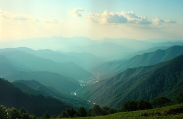 Fototapeta premium Vast mountain range stretches to horizon. Misty valley winds between peaks. Green forests blanket slopes. Road snakes through valley. Scenic panorama. Tranquil landscape. Serene scene perfect for