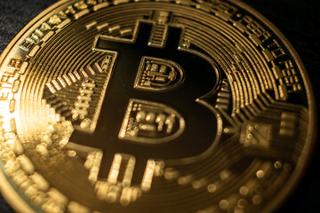 Golden Bitcoin Coin on Black Background