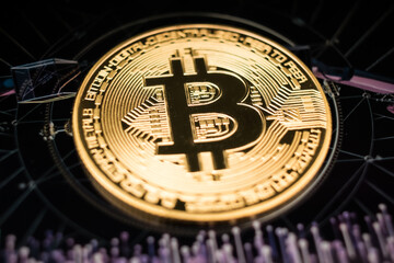 Golden Bitcoin Coin on Futuristic Digital Technology Background