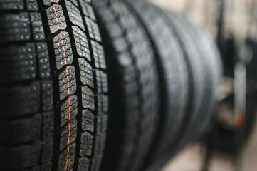 New car tire is placed on the tire storage rack in the tire factory. Be prepared for vehicles that need to change tires