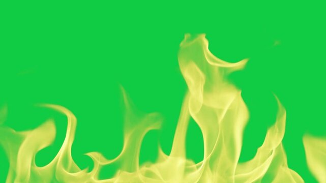 Looping video of fire flames and smoke, green screen for transparency, 4k.