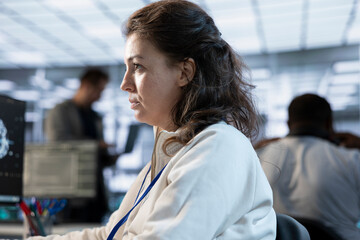 Computer scientist working in high tech server hub capable of processing vast amounts of data....