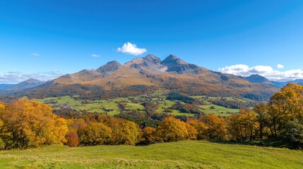 Naklejka premium Autumnal mountain valley landscape, colorful foliage, clear sky