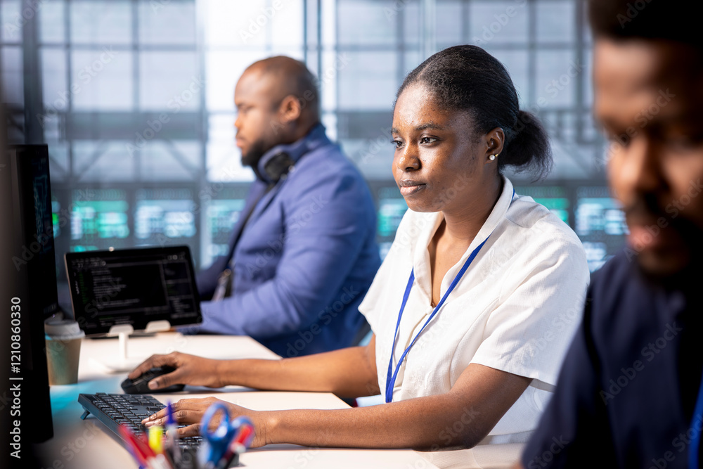 Poster african american developer in data center workspace using diagnostic tools and system monitoring sof