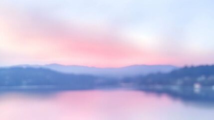 Obraz premium Dreamy pastel sunrise over calm lake and mountains, soft focus.