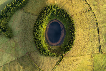 Aerial view of beautiful lagoon in Azores islands. Drone landscape with lines and textures in the background. Top view of volcanic crater, tourist attraction of Portugal.