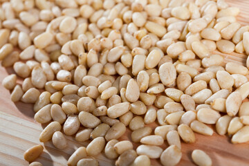 Picture of raw pine nut on the wooden desk, no people