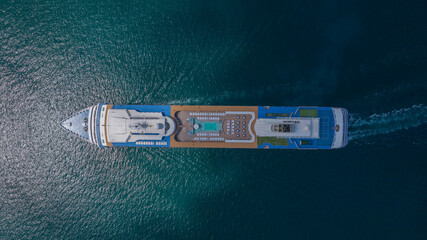 Aerial top view of large cruise ship at sea, passenger cruise ship sailing, maritime luxurious lifestyle, passenger ship