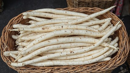Obraz premium Freshly harvested parsnips in a rustic wicker basket
