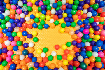 A cheerful and colorful ball pit perfect for kids' fun and playtime.