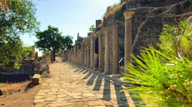 Ruins of the ancient Roman port city of Siedra in Alanya, Antalya, Turkey. The street and ruins of the ancient abandoned ancient city of Siedra on the Mediterranean coast. 4К
