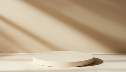 Beige round podium with sunlight shadows on light beige background.