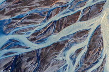 Abstract aerial view of rivers emerging from Icelandic glaciers. Mother nature has created stunning works of art in Iceland. high quality photo for a wallpaper backdrop