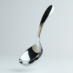 Shiny chrome spoon isolated on white background.