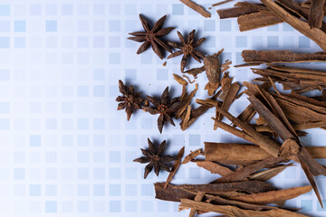 Top view of cinnamon stick and aniseed flowers or stars.