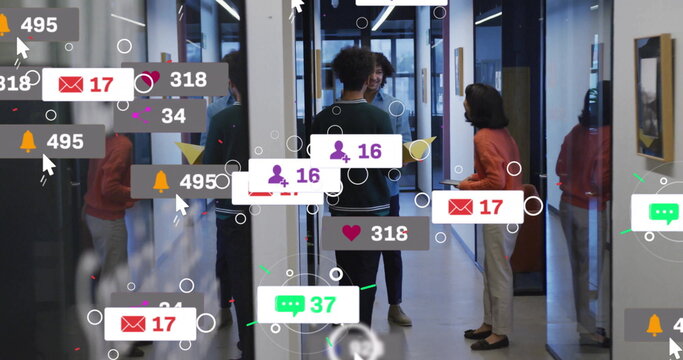 Image of social media notifications over diverse colleagues talking at casual office - Powered by Adobe
