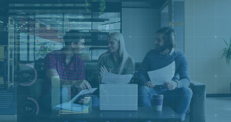 Image of financial data processing over diverse colleagues discussing work in office