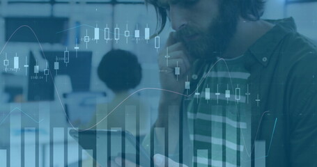 Image of financial data processing over caucasian businessman using tablet in office