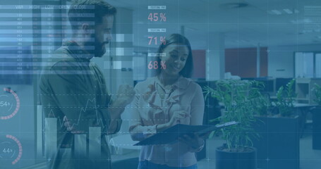 Image of financial data processing over diverse colleagues discussing work in office