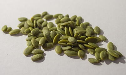Pumpkin seeds isolated, with white background. Healthy seeds.Healthy food. Vegan food concept .Source of vitamins and minerals