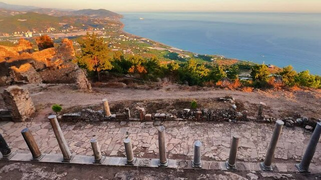 Ruins of the ancient Roman port city of Siedra in Alanya, Antalya, Turkey. The street and ruins of the ancient abandoned ancient city of Siedra on the Mediterranean coast. 4К