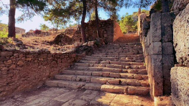 Ruins of the ancient Roman port city of Siedra in Alanya, Antalya, Turkey. The street and ruins of the ancient abandoned ancient city of Siedra on the Mediterranean coast. 4К