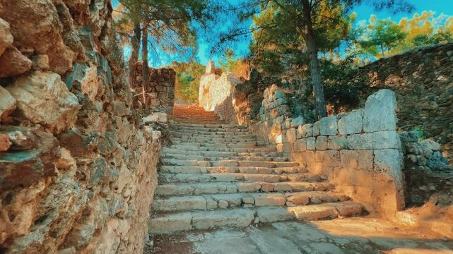 Ruins of the ancient Roman port city of Siedra in Alanya, Antalya, Turkey. The street and ruins of the ancient abandoned ancient city of Siedra on the Mediterranean coast. 4К