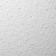 Obraz premium Close-up of textured white wall with dotted surface, ideal for backgrounds and designs.
