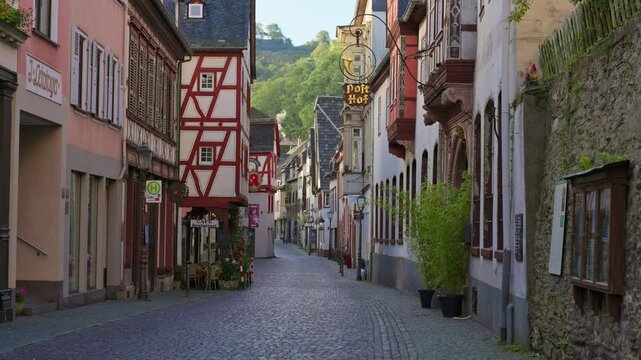 Moving down an empty cobblestone street on an early sunny morning in a small historic German town of Bacharach