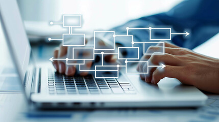 Digital flowchart overlays on hands typing on a laptop keyboard symbolizing data processing..