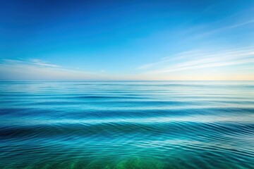 Obraz premium Serene Ocean Vista A Calm Seascape Under a Vast Blue Sky with Gentle Waves