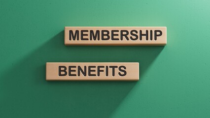 MEMBERSHIP BENEFITS word. Wooden cube blocks. Copy space.3D rendering on green background.