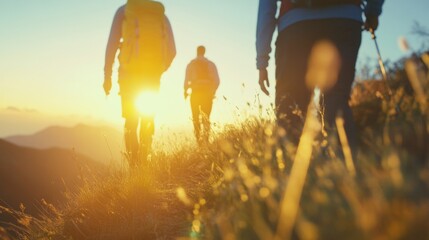 Hikers ascend a mountain ridge at dawn, surrounded by vibrant colors and fresh air, enjoying the serene landscape and each other's company