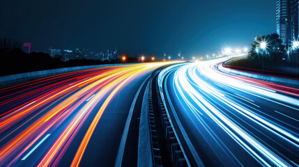 Fototapeta premium Long exposure shot of busy highway at night, showcasing vibrant light trails from vehicles. scene captures dynamic movement and energy of urban life