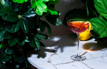 Killer Queen alcoholic cocktail drink with gin, French aperitif, bitters liqueur and lemon peel....