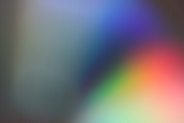 Obraz premium Light waves interference effect, color diffraction grating abstract background. Iridescent blurred holographic surface.