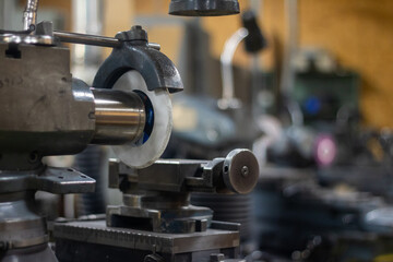 A big industrial precision cutting machine in a warehouse.