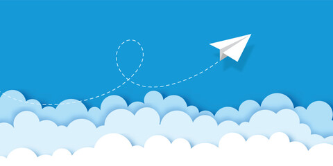 White paper airplane flying over clouds paper cut style with dashed lines on blue sky banner business background