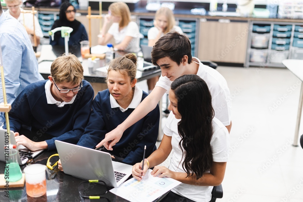 Fototapete Diverse group of students collaborate in science lab. Diverse students, teamwork, and learning in school classroom. Diverse students collaborate in science class, teamwork group project at school