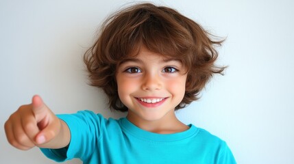 Closeup portrait of a cheerful young boy showing thumbsup gesture, expressing positivity.
