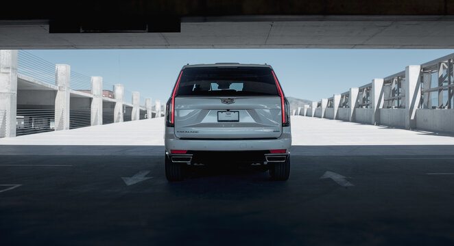 Cadillac, Escalade, 2024, White, Exterior, SUV, Luxury, Luxurious, Parking Garage, Premium, Modern, Elegant, High-End, Urban, Automotive, Sport Utility Vehicle, Classy