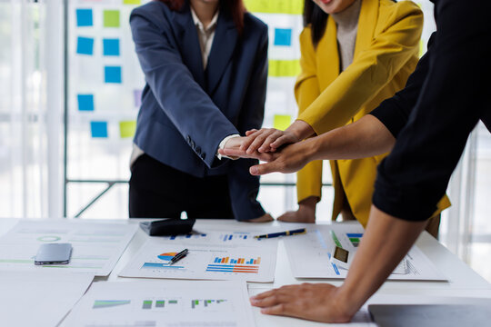 Business team standing hands together, Volunteer charity work. People join for cooperation success business. Panoramic teamwork business joins hand together concept,	