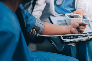 The doctor woman hand use the pulse meter to measure the pressure of the patient, medical checkup concept.