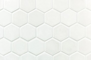 Naklejka premium A clean, white hexagonal tile pattern, creating a modern and minimalist aesthetic ideal for contemporary spaces.